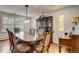 Elegant dining room with hardwood floors and large windows at 12000 W 29Th Pl, Wheat Ridge, CO 80215