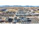 Wide aerial view of community featuring townhouses and mountain views at 11420 Uptown Ave, Broomfield, CO 80021