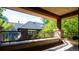 Covered balcony with wood beams and tile flooring, providing outdoor space at 2435 S Milwaukee St, Denver, CO 80210