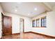 Finished basement with stained concrete floors and access to a bathroom at 2435 S Milwaukee St, Denver, CO 80210