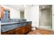 Modern bathroom with gray countertop and walk-in shower at 2435 S Milwaukee St, Denver, CO 80210