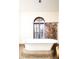 Elegant bathroom showcasing a freestanding tub and window at 2435 S Milwaukee St, Denver, CO 80210