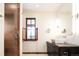 Modern bathroom with a contemporary sink, glass shower, and tiled floors at 2435 S Milwaukee St, Denver, CO 80210