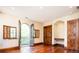 Spacious bedroom with hardwood floors, access to a balcony, and ample natural light at 2435 S Milwaukee St, Denver, CO 80210