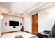Basement home theater with seating and large TV at 2435 S Milwaukee St, Denver, CO 80210