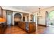 Gourmet kitchen boasts a large island, stainless steel appliances, and custom cabinetry at 2435 S Milwaukee St, Denver, CO 80210