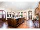 Large kitchen with an island, custom cabinetry, and hardwood floors at 2435 S Milwaukee St, Denver, CO 80210