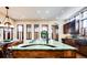Island kitchen features a large green marble island with sink and seating at 2435 S Milwaukee St, Denver, CO 80210