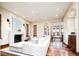 Open living space with hardwood floors, stone fireplace, and sectional sofa at 2435 S Milwaukee St, Denver, CO 80210