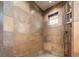 Modern shower with stone tile and rainfall shower head at 2435 S Milwaukee St, Denver, CO 80210