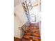 Grand staircase with ornate railing and hardwood treads at 2435 S Milwaukee St, Denver, CO 80210