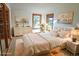 Charming bedroom with a queen-size bed and rustic dresser at 9722 Lost Dove Trl, Golden, CO 80403