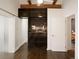 Bedroom with built-in shelving and access to a full bathroom at 1253 Elizabeth St, Denver, CO 80206