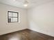 Simple bedroom with hardwood floors, and a window at 1253 Elizabeth St, Denver, CO 80206