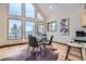 Bright dining area with hardwood floors and mountain views at 5879 High Dr, Evergreen, CO 80439