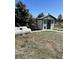 White shed with green trim and propane tanks at 2099 Helen Ct, Parker, CO 80138