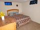 Basement bedroom with a double bed and wooden dresser at 2860 Ames St, Wheat Ridge, CO 80214