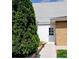 View of a home's back entrance with a walkway and landscaping at 2860 Ames St, Wheat Ridge, CO 80214