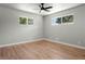 Bright bedroom featuring hardwood floors and neutral wall colors at 10680 Carrol Ln, Northglenn, CO 80233