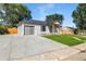 Newly built home with gray brick exterior, garage, and landscaped lawn at 10680 Carrol Ln, Northglenn, CO 80233