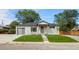 Newly built home with gray brick exterior and attached garage at 10680 Carrol Ln, Northglenn, CO 80233