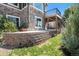 Modern retaining wall with stone and block elements, providing landscape definition at 7479 S Biloxi Ct, Aurora, CO 80016