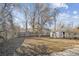 Spacious backyard with mature trees and shed at 2756 W Iowa Ave, Denver, CO 80219