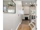 Bright entryway with a modern fireplace and hardwood floors at 12953 E Cornell Ave, Aurora, CO 80014