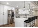 Stainless steel appliances and white shaker cabinets in kitchen at 12953 E Cornell Ave, Aurora, CO 80014