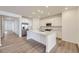 Modern kitchen featuring white shaker cabinets, a large island, and stainless steel appliances at 2966 S Quaker St, Morrison, CO 80465