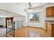 Bright dining area with hardwood floors and a view of the backyard at 7420 W Caley Dr, Littleton, CO 80123