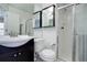 Modern bathroom with tiled shower and white fixtures at 12008 E Tennessee Dr, Aurora, CO 80012