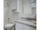 Bathroom with shower/tub combo, toilet, sink, and mirror at 12008 E Tennessee Dr, Aurora, CO 80012