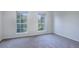 Empty bedroom with carpet and windows at 12008 E Tennessee Dr, Aurora, CO 80012