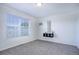 Well-lit bedroom with a window, carpeting, and neutral decor at 12008 E Tennessee Dr, Aurora, CO 80012