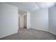 Empty bedroom with carpet flooring, a closet, and white walls at 12008 E Tennessee Dr, Aurora, CO 80012