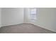 Empty bedroom with carpet flooring and a window with blinds at 12008 E Tennessee Dr, Aurora, CO 80012