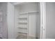 Empty closet with built-in shelves and hanging rod at 12008 E Tennessee Dr, Aurora, CO 80012