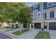 Exterior elevation of townhome with attached garage and landscaping at 12008 E Tennessee Dr, Aurora, CO 80012
