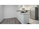 Compact kitchen featuring stainless steel appliances and ample counter space at 12008 E Tennessee Dr, Aurora, CO 80012