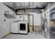 Laundry room in basement with washer, dryer, and mechanicals at 12008 E Tennessee Dr, Aurora, CO 80012
