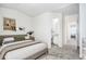 Bedroom with access to bathroom and hallway at 12008 E Tennessee Dr, Aurora, CO 80012