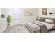 Cozy bedroom with neutral decor and carpeted floors at 12008 E Tennessee Dr, Aurora, CO 80012