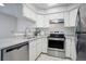 Modern kitchen with stainless steel appliances and dishwasher at 12008 E Tennessee Dr, Aurora, CO 80012