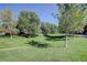 Common area with grassy lawn and mature trees at 12008 E Tennessee Dr, Aurora, CO 80012