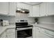Stainless steel stove and range in updated kitchen at 12008 E Tennessee Dr, Aurora, CO 80012