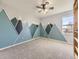 Bedroom with mountain mural and ceiling fan at 5035 Bayou Gulch St, Parker, CO 80134