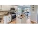 Modern kitchen with granite countertops, stainless steel appliances, and an island at 5035 Bayou Gulch St, Parker, CO 80134