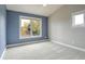 Spacious bedroom with two-toned walls and a large window at 920 Sunny Way, Lafayette, CO 80026