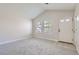 Bright living room with neutral carpeting and large windows at 1758 Eagle St # C, Aurora, CO 80011